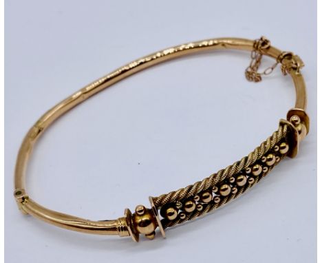 A 9ct rose gold hinged bangle, weight 6.3g