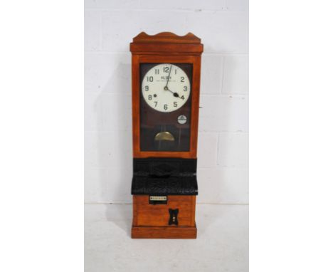 A Blick Time Recorder oak cased clocking in machine, with key and pendulum - length 34cm, depth 28cm, height 103cm