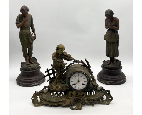 A gilt metal mantle clock with dial and movement by Jean Le Gallais along with a pair of spelter figures with plaques reading
