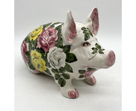 A large Wemyss pig in yellow, white and pink cabbage rose pattern signed to the underside 'Wemyss, EXON 2791, B. Adams' and i