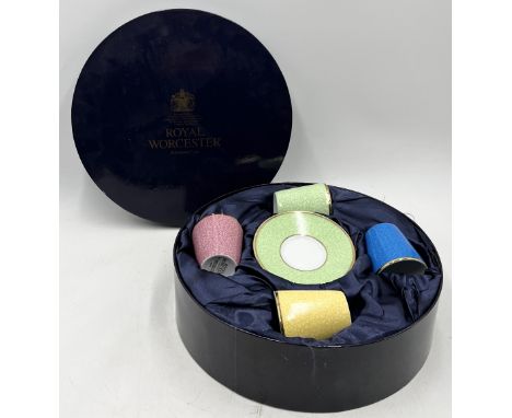 A boxed set of four Royal Worcester royal commemorative coffee cans and saucers "In Celebration of HRH 80th Birthday" 