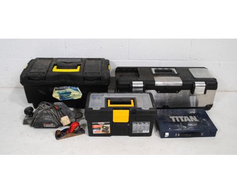 Three tool boxes containing various tools, including a Black & Decker planer, Titan drill bit set etc.