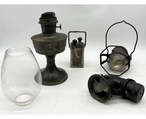 A collection of items including vintage carbide, oil lamp, accumulator and early example of a torch 