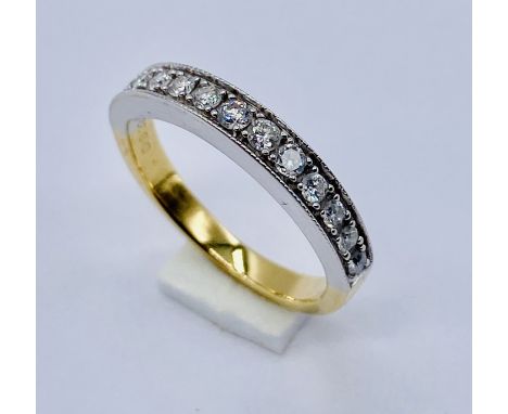 An 18ct gold half eternity ring set with diamonds, weight 3.3g, size K