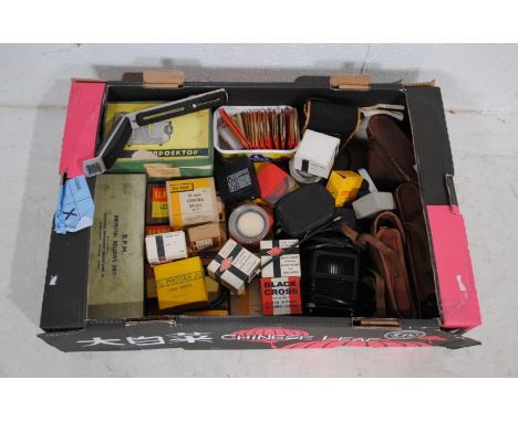 A collection of vintage cameras and accessories, including Canon, Paxina, Kodak etc.