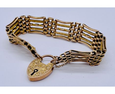 A 9ct rose gold gate bracelet with engraved 9ct padlock, weight 22.1g
