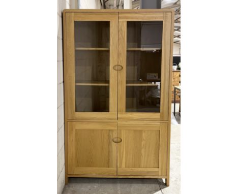An Ercol Bosco light oak display cabinet with glass doors and two cupboards under - 190cm x 115cm x 40cm