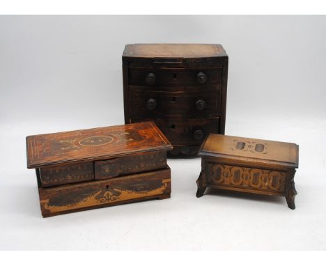 An antique apprentice piece bow-fronted chest of three drawers with inlaid detailing (A/F) with label to base for Robinsons M