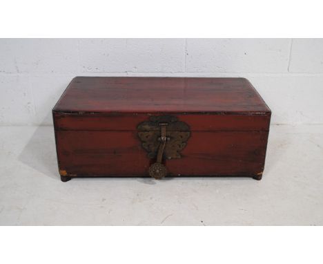 A small Chinese lacquered wooden trunk - length 71cm, depth 40cm, height 26cm