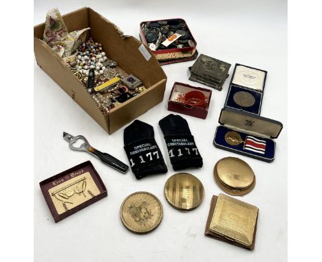 A collection of costume jewellery, Special Constabulary epaulettes, buttons and medal, compacts etc.