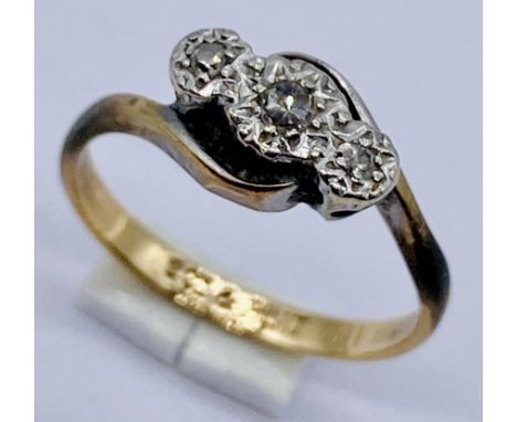 A 9ct gold and platinum diamond three stone ring, size J