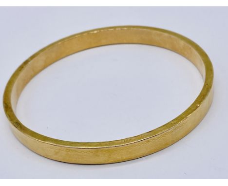 A 15ct gold "slave" bangle, weight 14.8g
