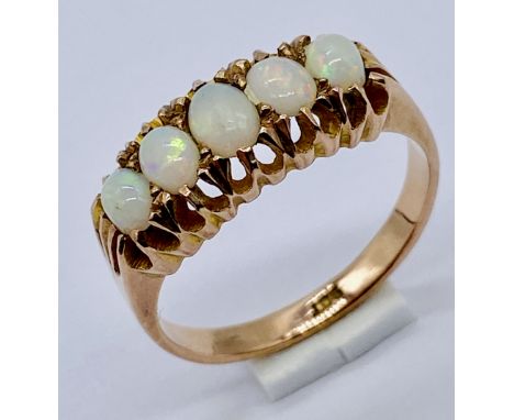 An opal five stone ring set in 9ct gold, size O 1/2