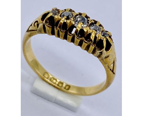 An 18ct gold diamond five stone "boat " ring, size L