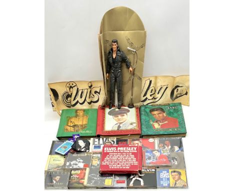 An assortment of Elvis Presley memorabilia including three scrapbooks of vintage newspaper & magazine cuttings, a box set of 