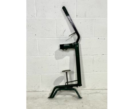 A vintage bottle corking machine