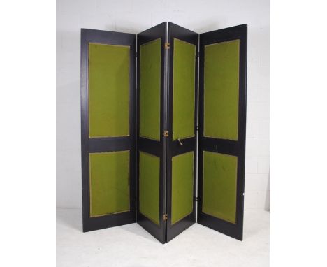 A vintage four fold screen, with green baize panels - each panel measures 61cm x 213cm 