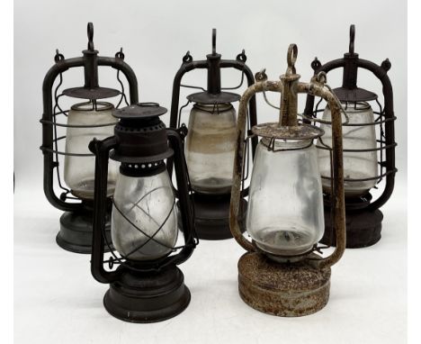 A collection of five vintage oil lanterns including one dated 1941, Gremlin etc. 