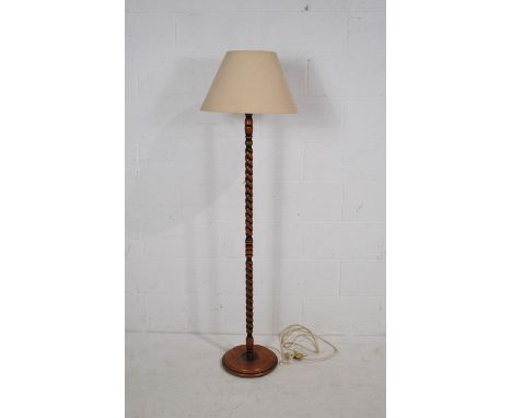 An oak barley-twist standard lamp, with shade