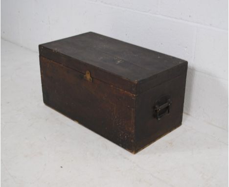 An antique mahogany storage trunk