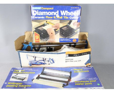 A Precision Mitre Box And Saw, Diamond Wheel Ceramic Tile Cutter and a Wallpaper Pasting Machine. [3]