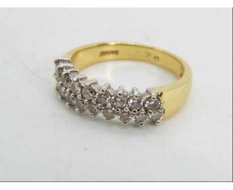 18ct gold - a 18 ct gold ring set with eighteen diamond, stamped .76, size N. approx weight 5.26 g 