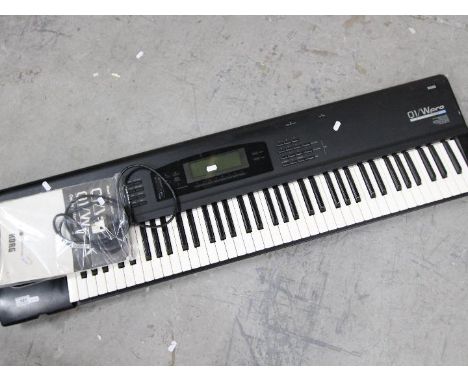 A Korg O1/W Pro keyboard synthesizer, with instruction manual.