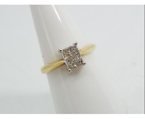 18ct gold - a 18 ct gold ring set with twelve princess cut diamonds, stamped 750, size N, approx 3.60g 