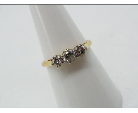 18ct gold - a 18 ct gold trilogy ring, set with diamonds, approx half a carrat size N, approx weight 2.45 g 