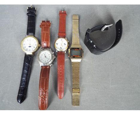 A small collection of wristwatches including a vintage Sekonda digital watch and similar.