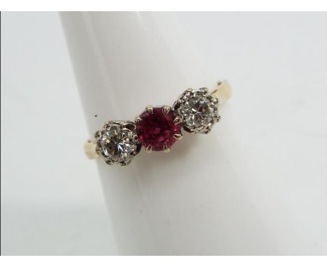 18ct gold platinum - a 18 ct gold platinum trilogy ring, stone set with Ruby and Diamonds, size N, approx weight 2.71 g 