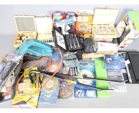 Various tools to include a Black &amp; Decker planer, electric nailer / stapler, drill bits and other accessories.
