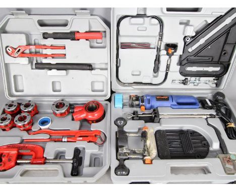 A cased pipe threading set and an Inventek spiral saw set, also cased. [2]