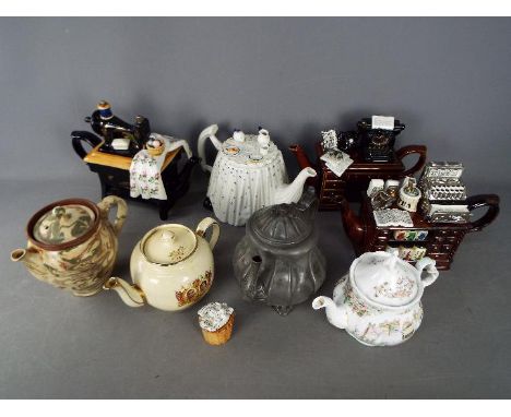 A collection of predominantly ceramic teapots (one pewter) including a Royal Doulton Brambly Hedge example.Condition Report: 