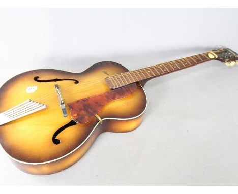 A Hofner Compensator six - string acoustic guitar, ca 1950s, model Congress, serial no 7626 - included in the lot is a guitar