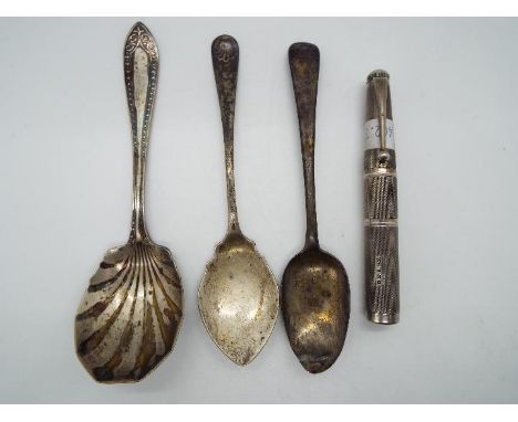 A small collection of hallmarked silver items to include spoons and a George VI everlasting match in the form of a pen having