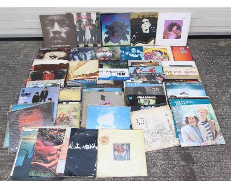 A collection of 12" vinyl records to include The Who, Blondie, Lou Reed, U2, Kate Bush, Bob Marley &amp; The Wailers, Jimi He