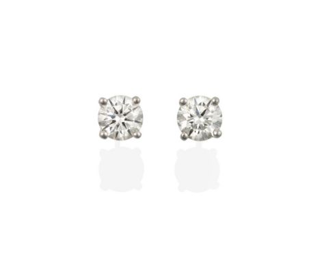 A Pair of 18 Carat White Gold Diamond Solitaire Earrings, the round brilliant cut diamonds in four claw settings, total estim