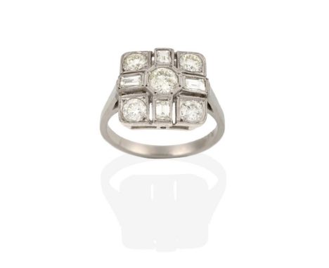 An Art Deco Style Diamond Cluster Ring, the plaque form inset with round brilliant and baguette cut diamonds, in white claw a