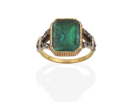 A Georgian Emerald and Diamond Ring, the emerald-cut emerald in a yellow millegrain setting, to white forked rose cut diamond