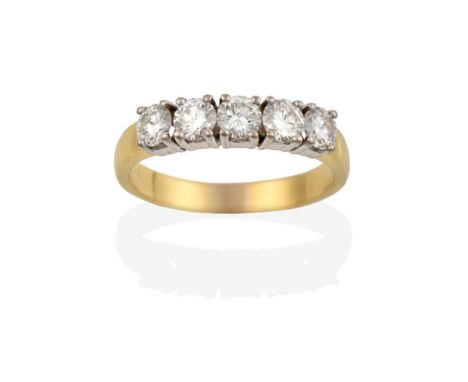 An 18 Carat Gold Diamond Five Stone Ring, the round brilliant cut diamonds in white claw settings, to a yellow plain polished