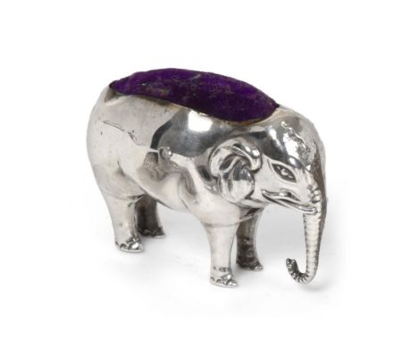 An Edward VII Silver Pin-Cushion, by Adie and Lovekin Ltd., Birmingham, 1906, realistically modelled as an elephant, 7cm. Ful