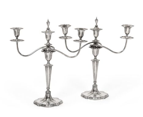 A Pair of George V Silver Three-Light Candelabra, by James Henry and Herbert Barraclough, Sheffield, 1911, each on shaped ova