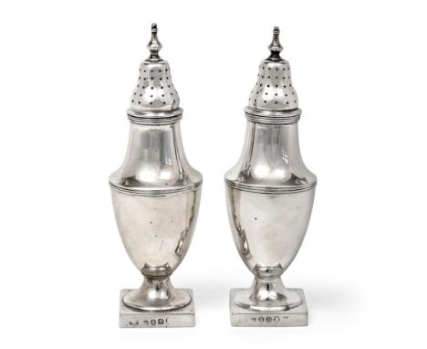 A Pair of George III Silver Pepperettes, Maker's Mark IC, London, 1792, each vase-shaped and on square pedestal foot, with re