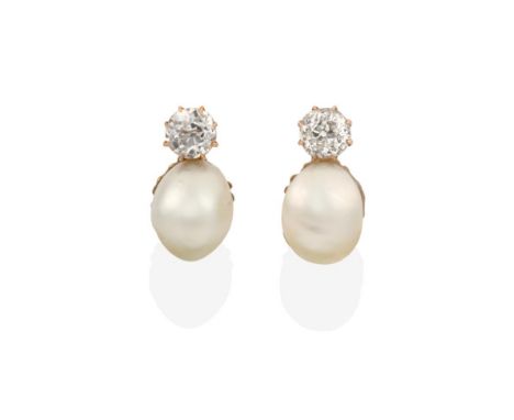 A Pair of Pearl and Diamond Earrings, an old cut diamond set above a pearl, in yellow claw settings, total estimated diamond 