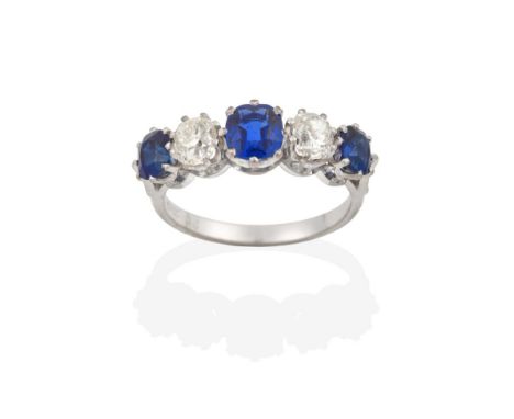 A Sapphire and Diamond Five Stone Ring, three oval cut sapphires alternate with two old cut diamonds, in white claw settings,