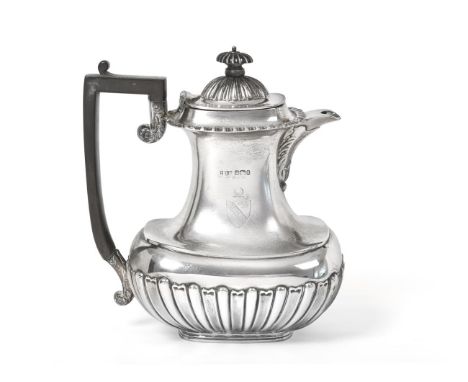 A Victorian Silver Hot-Water Jug, by Joseph Rodgers and Sons, Sheffield, 1899, baluster, the lower body part-fluted, with ebo