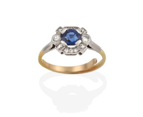 A Sapphire and Diamond Cluster Ring, the oval cut sapphire within an undulating border of eight-cut diamonds, in white claw a