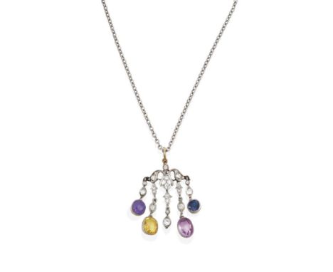 An Early 20th Century Sapphire and Diamond Pendant on Chain, the scroll motif suspends five articulated drops set throughout 