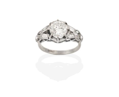 A Diamond Solitaire Ring, the round brilliant cut diamond in a white claw setting, to fancy baguette cut and eight-cut diamon